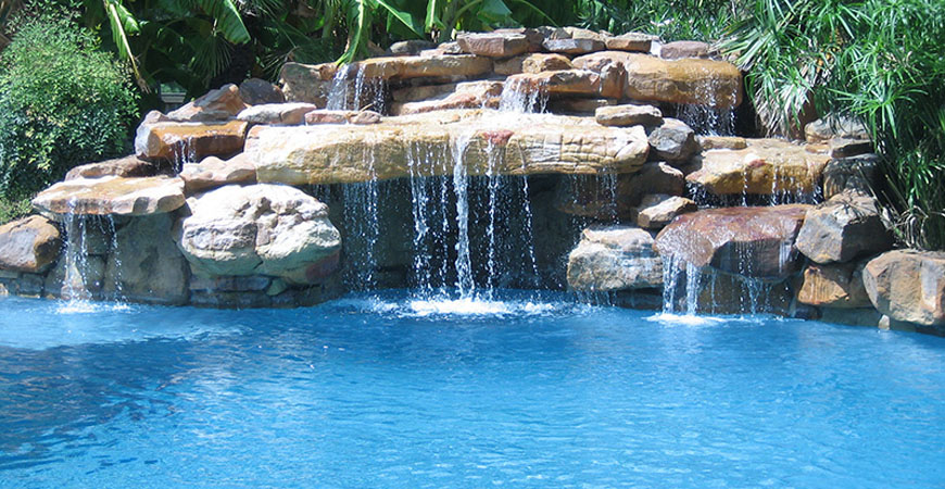 Natural rock waterfalls – Xperience Lawn Care